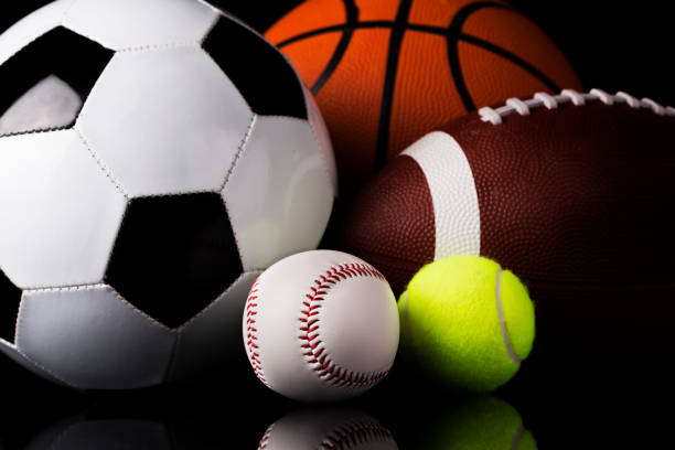 istock Sport balls on black background 986515390