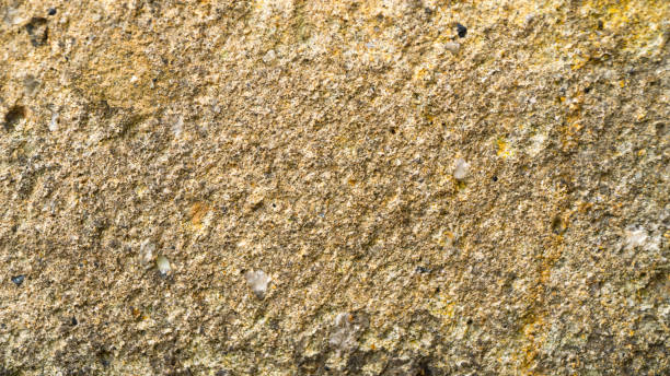 istock Background of old yellow stone texture. 986518306