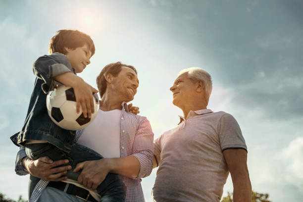 istock Happy family standing together and smiling 986518466