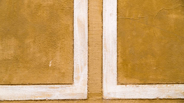 istock background of an old yellow stone with stripes. 986518828