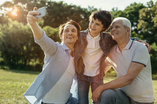 istock Joyful family taking selfie and smiling 986519424