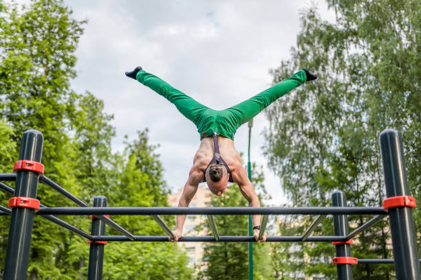 istock Strong Man Engaging Gymnastic Exercises Outdoors 986525618