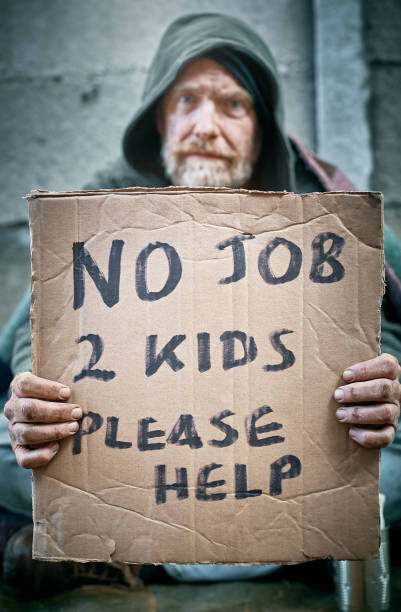 istock Homeless, jobless man begs for help 986528464