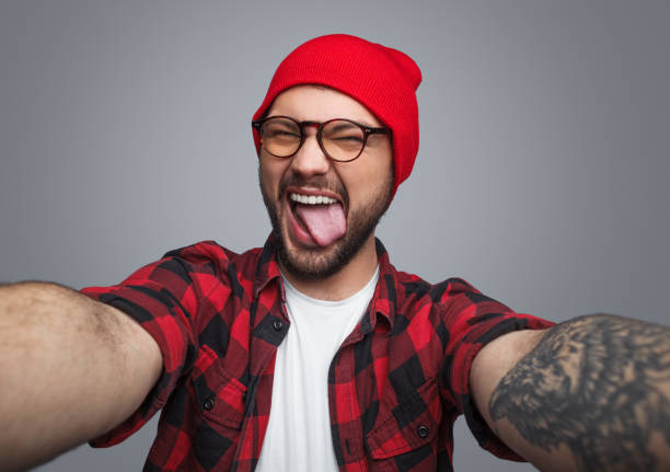 istock Rebel hipster guy taking selfie 986530066