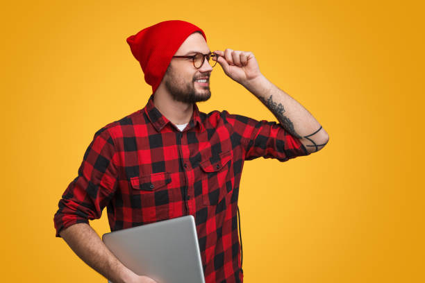 Trendy smart hipster with laptop