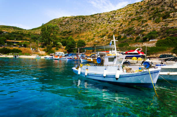 istock Fishing boat moored at picturesque dock 986556942