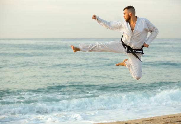 istock Adult man is training kick in jump 986572170