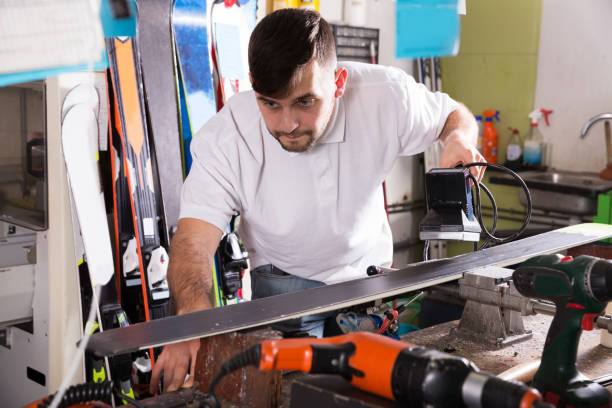 istock Workman repair of skis in workshop 986572858