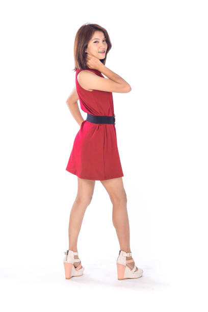 istock beautiful asian girl in red dress in a studio shot on white background (with selective focus) 986573708
