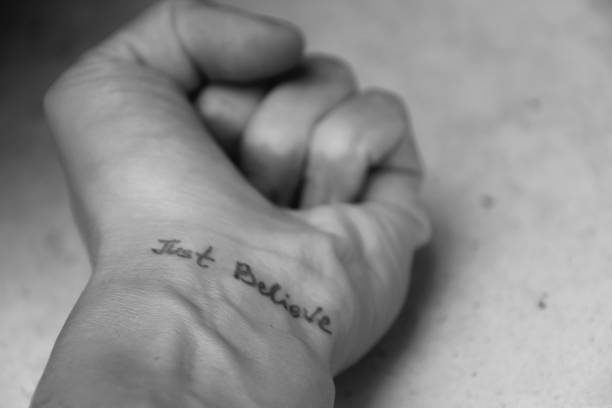 istock Handwritten motivational phrase on the human hand 