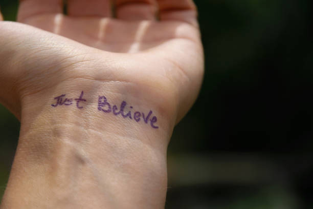 istock Handwritten motivational phrase on the human hand 
