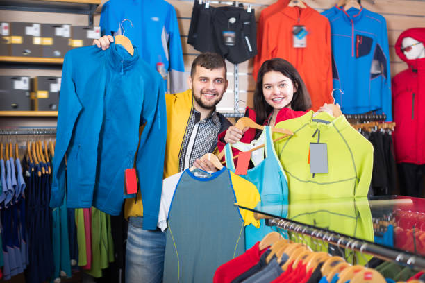 istock Laughing couple boasting sportswear items 986574514