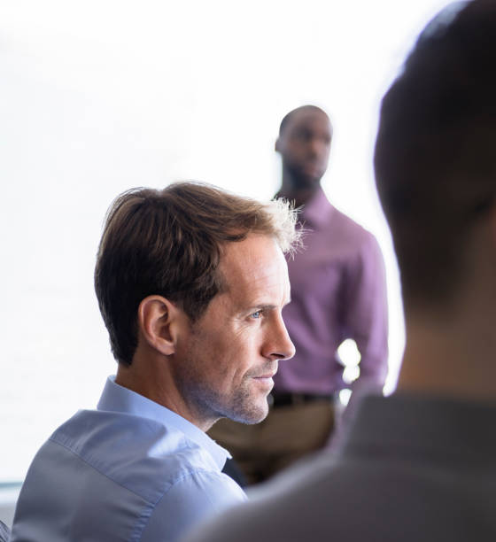 istock Businessman looking away in office 986580424
