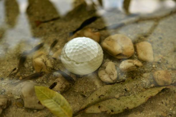 istock golf ball in water hazard 986587464