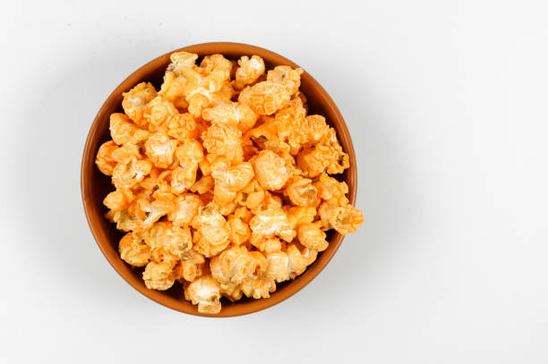 istock View from above popcorn in the brown bowl isolated on the white background 986592894