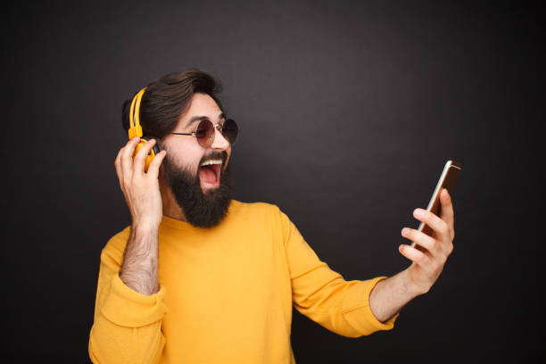 Trendy man taking selfie in sunglasses