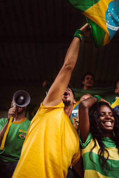 istock brazilian supporters have fun at the stadium 986604840