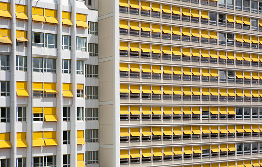 Unrecognisable facade of an office building - yellow sunblinds