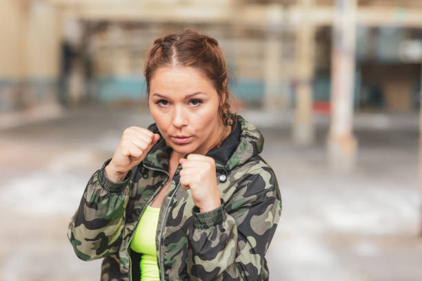 istock Woman in fighting stance 986605910