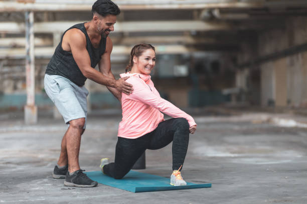 istock Man and woman stretching 986614022