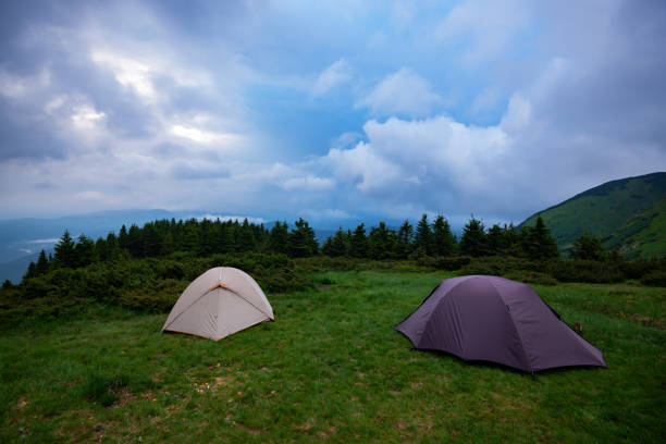 istock Tents in the mountains before storm 986614910