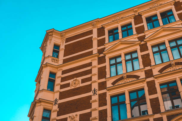 istock brick apartment building with white ornaments from the vanishing point view 986619150