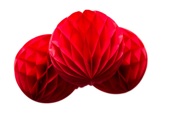 istock Red honeycomb  paper balls decoration isolated on white background 986620470