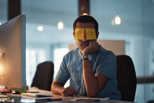 istock Trying to hide his exhaustion with humour 986621096