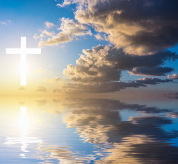 istock Cross silhouette against sky. 986629788
