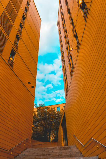 istock stairs between two modern orange buildings 986635440