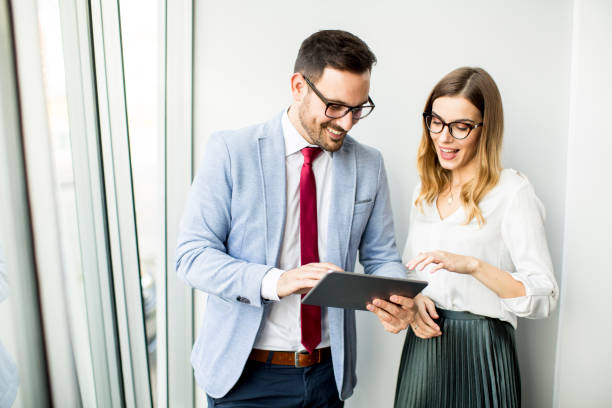 istock Businessman presenting business data on digital tablet at office 986639546