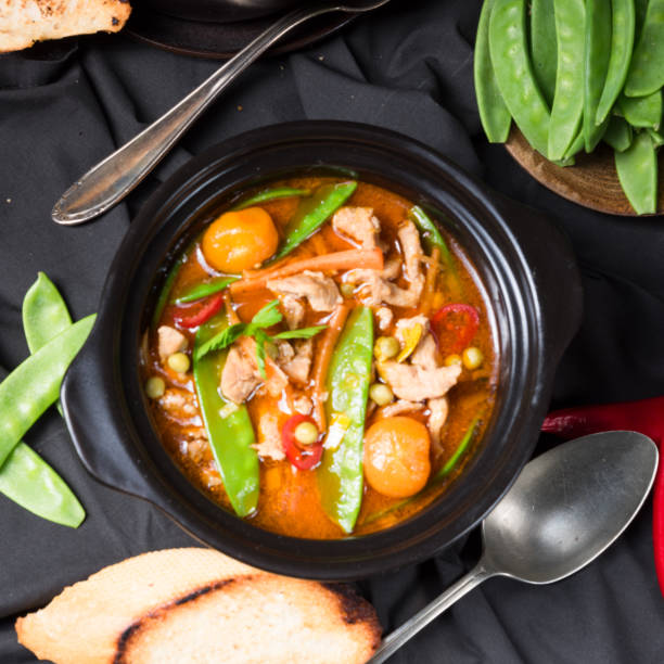 istock strips of pork  with sugar peas and other vegetables 986641090