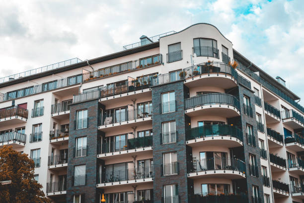istock white and black colored corner building with curved balcony 986649632
