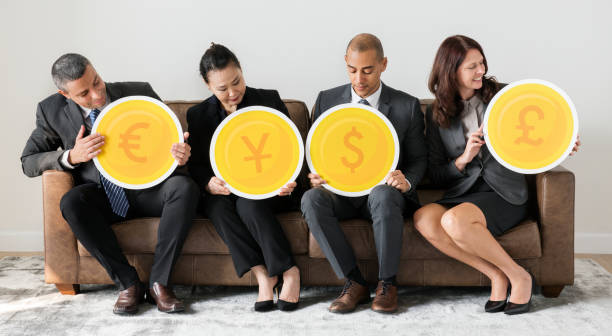 istock Business people holding currency icons 986652146