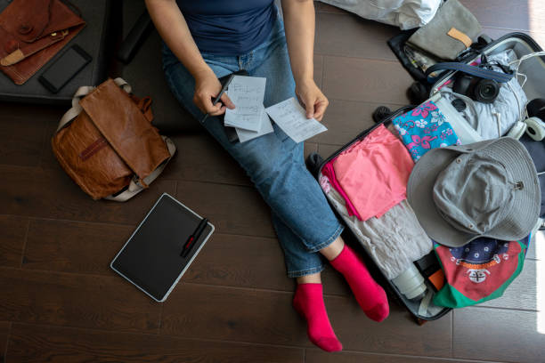 istock making travel plan on hotel room floor 986656132
