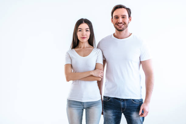 istock The happy man and a woman standing on a white background 986657560
