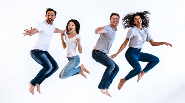 istock The happy people jumping on the white background 986658348
