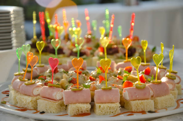 istock plastic colorful heart shape sticks on small sandwiches 986660086
