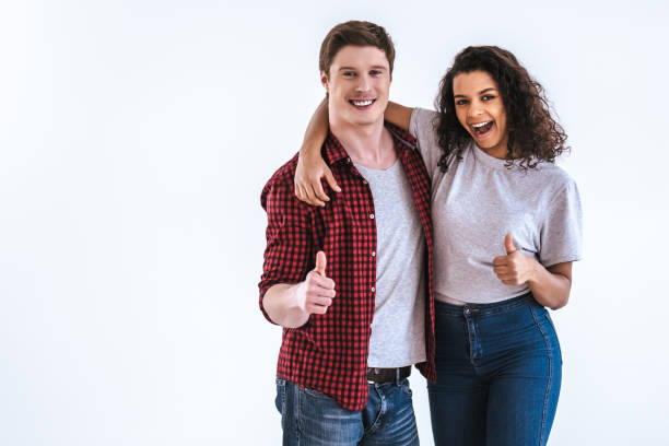 istock The happy couple gesturing on the white background 986661494