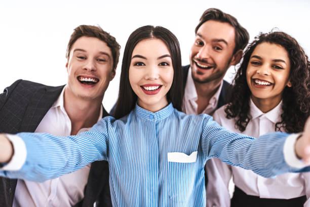 The four business people making selfie