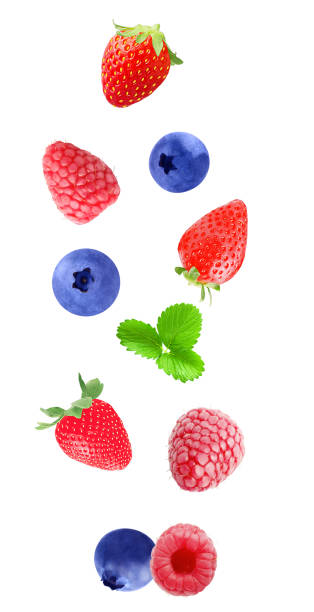 istock Falling strawberry, blueberry and raspberry fruits  isolated on white background with clipping path as package design element and advertising 986667300