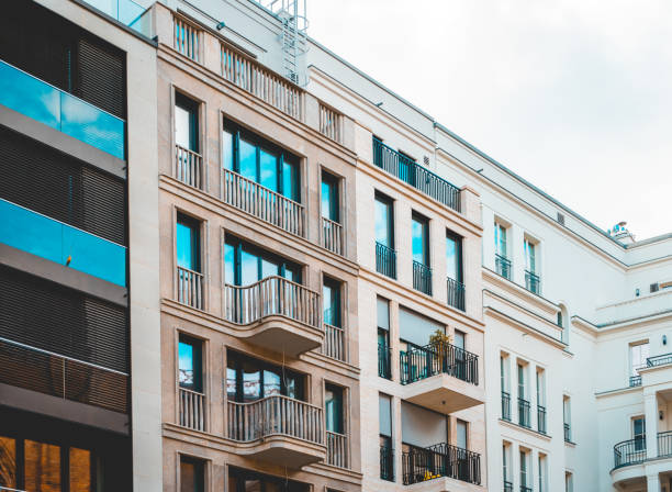 istock some modern townhouses with different facades in a row 986667886