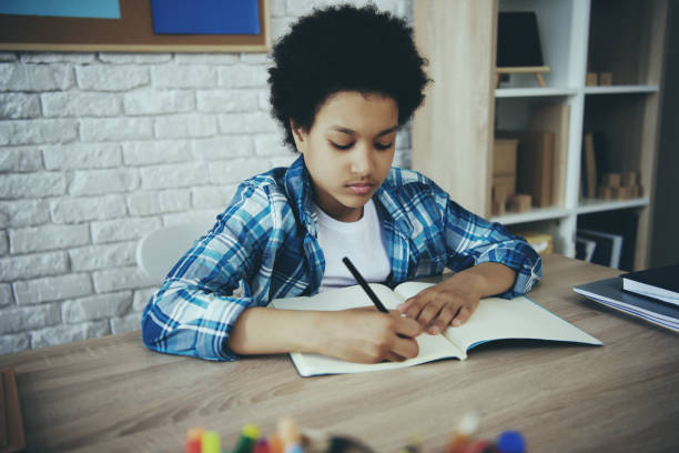 istock African American little preschooler doing homework 986678762