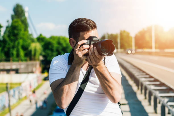 istock Photographer is taking photo on the road. 986678806