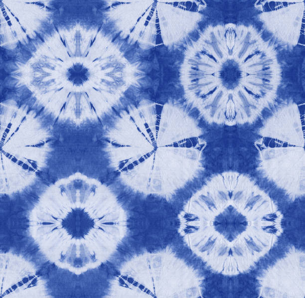 istock Seamless pattern, abstract tie dyed fabric of indigo color on white cotton. 986679016