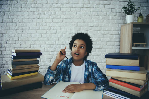 istock African American little boy is doing homework 986682328