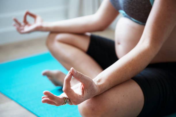 istock Pregnant woman doing light exercise 986690260