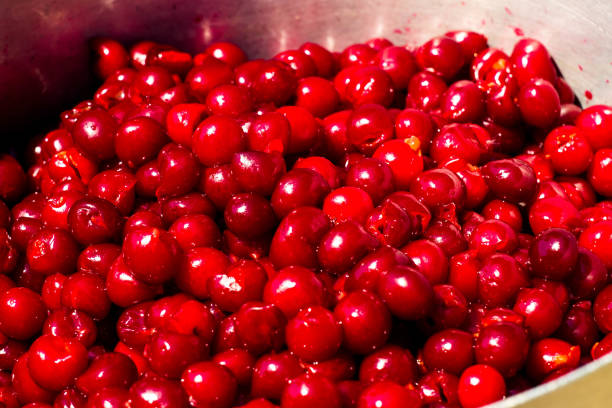 istock Ripe juicy cherries without bones blank for dessert. 986692124