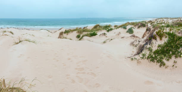 istock Cova de Alfarroba Beach, Portugal. 986698672