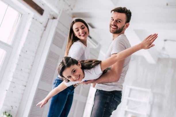 istock The happy daughter playing with parents 986705160